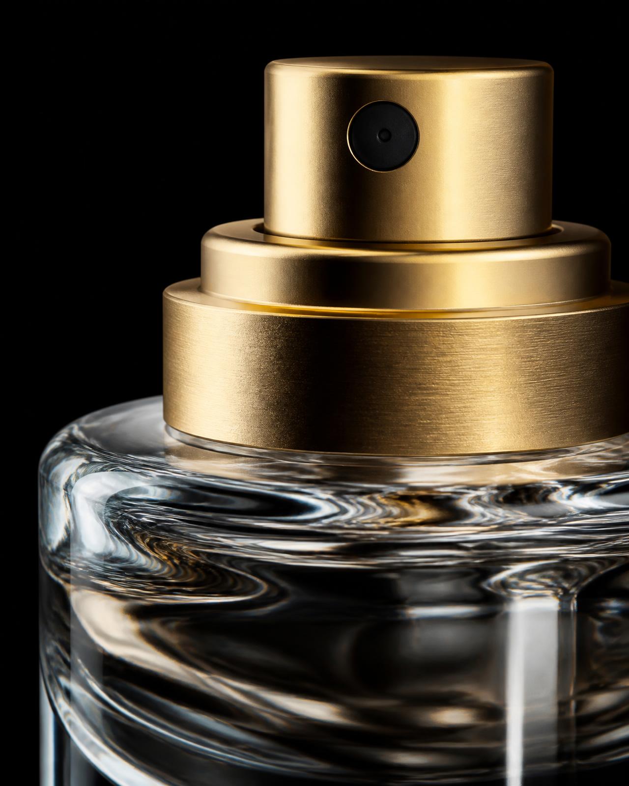 Macro detail of a perfume atomiser, collar and heavy glass